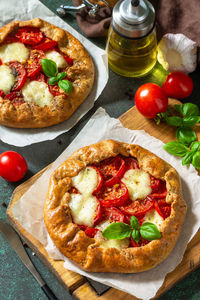 High angle view of pizza served on table