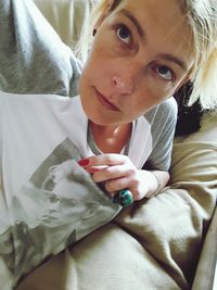 Portrait of cute baby lying on bed