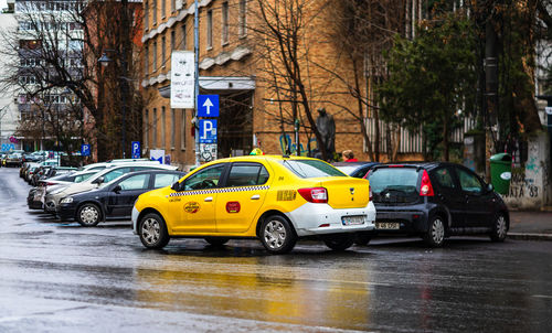 Yellow car on wet street