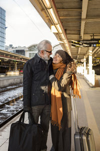 Mature couple on train station platform