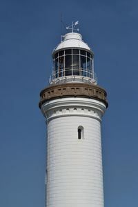 Low angle view of tower against clear blue sky