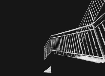 Low angle view of modern building against sky at night