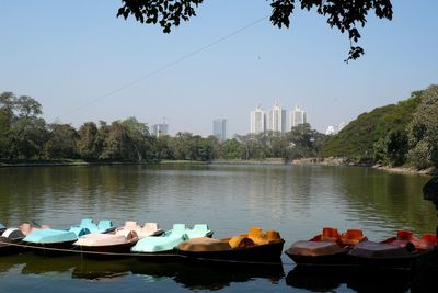 Boats in lake against clear sky