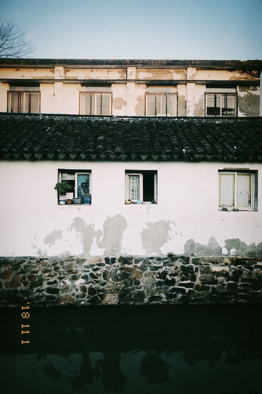 HOUSES AGAINST SKY IN CITY