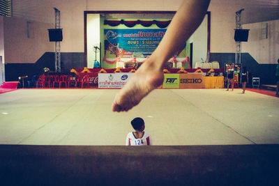 Full length of man skateboarding on floor