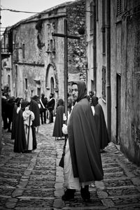 Rear view of people walking in temple