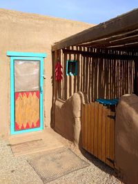 Clothes drying on wooden wall of building