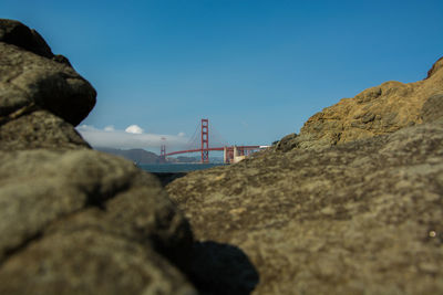 View of suspension bridge against clear blue sky