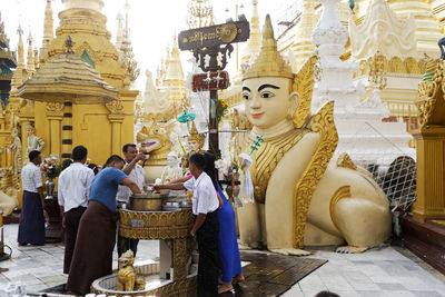 Panoramic view of statues outside building