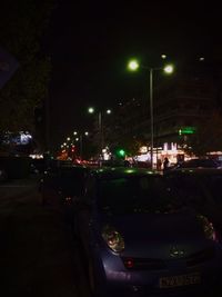 Cars on road in city at night