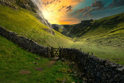 Scenic view of field against sky during sunset