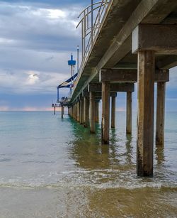 Pier over sea against sky