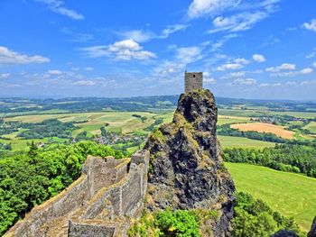 Old ruins on landscape against sky