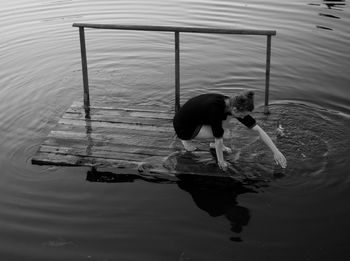 High angle view of boy swimming in lake