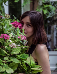 Portrait of woman with pink flowers