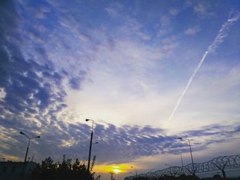 Low angle view of vapor trails in sky