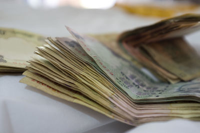 Close-up of paper currency on table