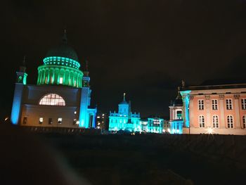 Illuminated buildings in city at night