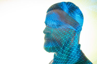 Portrait of man against blue background