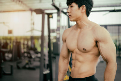 Close-up of muscular man standing in gym