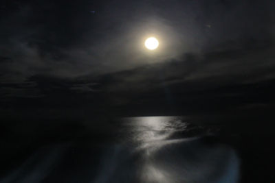 Low angle view of moon in sky at night