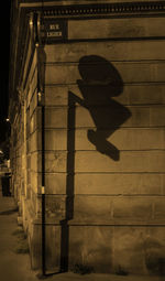 Shadow of man on wall at night