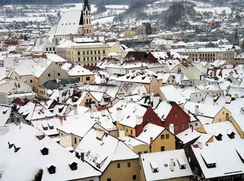 High angle view of snow covered buildings in town