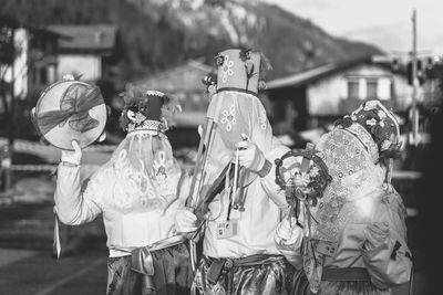 Ancient carnival of sauris. traditional wooden masks. black and white. italy