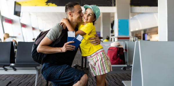 Little girl with her father at airport