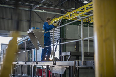 Factory worker in truck manufacture assembling truck parts