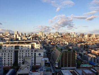 High angle view of city buildings against sky