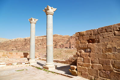 View of old ruins against blue sky