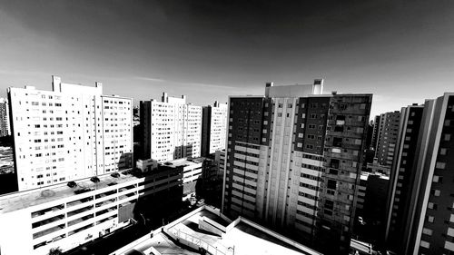 High angle view of buildings in city against sky