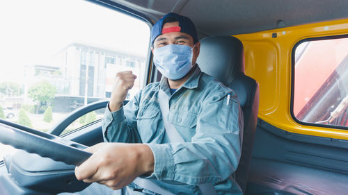 Man sitting in car