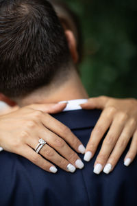 Cropped image of woman using mobile phone