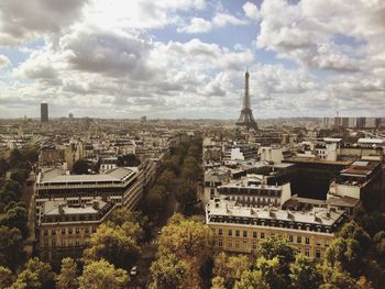 Buildings against cloudy sky
