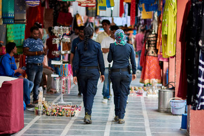 People walking on street market in city