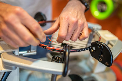 Cropped hands of man working in workshop