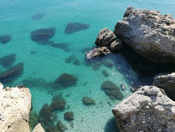 High angle view of rocks in sea