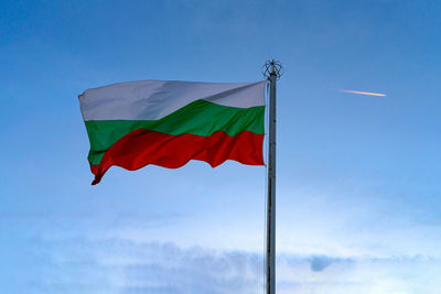 Low angle view of flag against sky