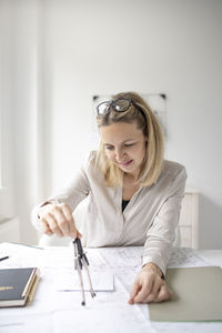 Woman working on table in office