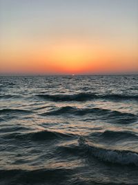 Scenic view of sea against clear sky during sunset