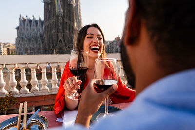 Young woman drinking wine in cafe