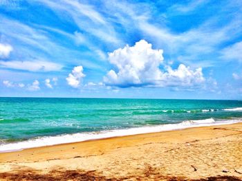 Scenic view of sea against cloudy sky