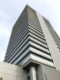 Low angle view of office building against sky