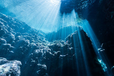 Rays of sunlight into the underwater cave