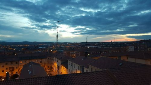 View of town against sky during sunset