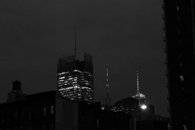 Low angle view of illuminated buildings against sky