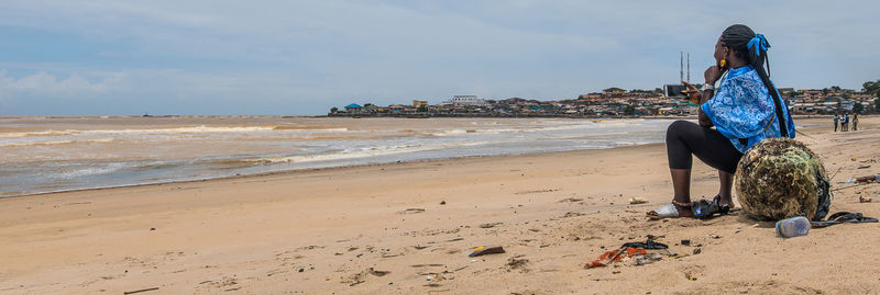 Woman sitting on beach