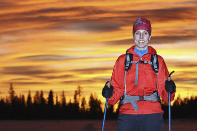 Woman skiing at sunset